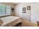 Bedroom with a window, closet, and wood-framed bed at 7303 N Branch Ave, Tampa, FL 33604