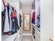 Organized walk-in closet with custom shelving and hanging rods at 7303 N Branch Ave, Tampa, FL 33604