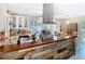 Modern kitchen with stainless steel appliances, butcher block countertops, and updated fixtures at 7303 N Branch Ave, Tampa, FL 33604