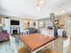 Open concept design with living, dining, and kitchen, perfect for modern living and entertaining at 7303 N Branch Ave, Tampa, FL 33604