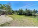 Expansive backyard featuring lush greenery and scenic water views at 7330 Cherry Laurel Dr, Port Richey, FL 34668