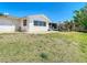 Well-maintained exterior showcasing a screened-in porch adding charm to the home at 7330 Cherry Laurel Dr, Port Richey, FL 34668