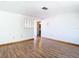 Living room with hardwood floors and white walls at 7330 Cherry Laurel Dr, Port Richey, FL 34668