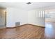 Bright living area featuring neutral walls and sleek hardwood floors at 7330 Cherry Laurel Dr, Port Richey, FL 34668