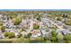 Aerial view of a residential neighborhood showcasing homes, tree-lined streets, and waterfront views at 7330 Cherry Laurel Dr, Port Richey, FL 34668