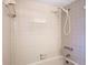 The bathroom features a shower with beige tile at 7330 Cherry Laurel Dr, Port Richey, FL 34668