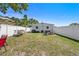Backyard featuring a patio with furniture, a privacy fence, and green space at 7401 35Th N Ave, St Petersburg, FL 33710