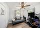 This bedroom features wood flooring, fan, and a closet at 7401 35Th N Ave, St Petersburg, FL 33710