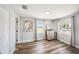 A bedroom features wood floors, neutral walls, and two windows with natural light at 7401 35Th N Ave, St Petersburg, FL 33710