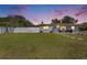Charming home with a well-manicured lawn and a white fence, creating a welcoming and private outdoor space at 7401 35Th N Ave, St Petersburg, FL 33710