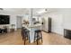 This view showcases a kitchen with a granite breakfast bar and stainless steel refrigerator at 7401 35Th N Ave, St Petersburg, FL 33710
