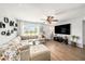 Bright living room featuring a comfortable sectional sofa, large windows, and modern decor for a cozy and inviting atmosphere at 7401 35Th N Ave, St Petersburg, FL 33710
