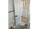 Bathroom door and green rug on white tile at 801 53Rd N Ter, St Petersburg, FL 33703