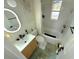 Well-lit bathroom featuring modern vanity and updated fixtures at 801 53Rd N Ter, St Petersburg, FL 33703