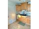 Functional kitchen featuring wood cabinets and hardwood flooring at 801 53Rd N Ter, St Petersburg, FL 33703