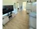 Open-concept living room with modern furniture, hardwood floors, and a view into other rooms at 801 53Rd N Ter, St Petersburg, FL 33703