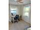 Well-lit home office featuring a modern desk setup, comfortable chair, and stylish decor at 801 53Rd N Ter, St Petersburg, FL 33703