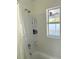 Bright bathroom showing tiled shower with shower products and fixtures at 801 53Rd N Ter, St Petersburg, FL 33703