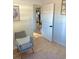 Cozy sitting area with a comfortable chair, soft rug, and doorway leading to other rooms at 801 53Rd N Ter, St Petersburg, FL 33703