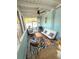 Comfortable sunroom with stylish seating, a ceiling fan, and lots of natural light at 801 53Rd N Ter, St Petersburg, FL 33703