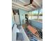 Inviting sunroom features modern furniture, laundry access and plenty of light at 801 53Rd N Ter, St Petersburg, FL 33703