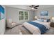Serene bedroom with a plush bed, soft lighting, and calming blue accents at 8136 Honeybee Ln, Tampa, FL 33635