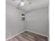 Bedroom with neutral paint, ceiling fan and wood floors and natural light from a window at 8136 Honeybee Ln, Tampa, FL 33635