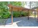 Carport featuring a large paved area at 8136 Honeybee Ln, Tampa, FL 33635