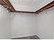 A simple closet with white walls and carpet at 8136 Honeybee Ln, Tampa, FL 33635