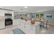 Bright open kitchen with a large island and adjoining dining area at 8136 Honeybee Ln, Tampa, FL 33635