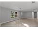 Bright living room with tile flooring and large windows at 8136 Honeybee Ln, Tampa, FL 33635