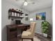 Office space featuring desk, chair, and shelving at 8136 Honeybee Ln, Tampa, FL 33635