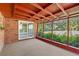 Enclosed outdoor patio space featuring brick columns and walls at 8136 Honeybee Ln, Tampa, FL 33635
