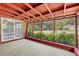 A covered outdoor patio with access to the backyard, great for relaxing and entertaining at 8136 Honeybee Ln, Tampa, FL 33635