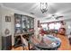 Bright dining room adjacent to living room offers comfortable seating at 10035 Cherry Creek Ln, Port Richey, FL 34668