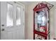 Bright entryway with a door and display cabinet at 10035 Cherry Creek Ln, Port Richey, FL 34668