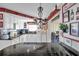 Charming kitchen featuring white cabinetry, stylish countertops, and decorative accents at 10035 Cherry Creek Ln, Port Richey, FL 34668