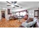 Spacious living room featuring wood floors, natural light and comfortable seating at 10035 Cherry Creek Ln, Port Richey, FL 34668
