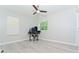 Bright bedroom features a modern ceiling fan, light grey walls and light wood floors at 11118 Golden Silence Dr, Riverview, FL 33579