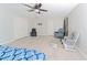 Spacious bedroom with light wood-look floors and multiple seating options at 11118 Golden Silence Dr, Riverview, FL 33579