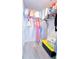 Organized closet with wire shelves and hanging rods, plus light wood laminate flooring at 11118 Golden Silence Dr, Riverview, FL 33579