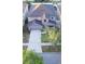 Aerial view of a well-maintained two-story home with a long driveway and mature landscaping at 11118 Golden Silence Dr, Riverview, FL 33579