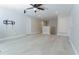 Open hallway with light grey walls, white trim, and light wood-style laminate flooring at 11118 Golden Silence Dr, Riverview, FL 33579