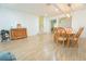 Open-concept living room featuring tiled floors, a side staircase, and stylish furnishings at 11118 Golden Silence Dr, Riverview, FL 33579