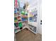 Spacious pantry with custom shelving, providing ample storage for groceries and household items at 11118 Golden Silence Dr, Riverview, FL 33579