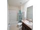 Bathroom with a shower, tub, toilet, vanity, and a sink at 11517 Koti Creek Ln, Thonotosassa, FL 33592