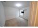 Bedroom with carpet, white walls, a TV, and a window with blinds at 11517 Koti Creek Ln, Thonotosassa, FL 33592