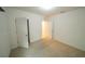 Bedroom with carpet, open white door, and a closet door at 11517 Koti Creek Ln, Thonotosassa, FL 33592