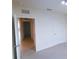 Bedroom featuring neutral carpet, white walls, and doorway leading to other rooms at 11517 Koti Creek Ln, Thonotosassa, FL 33592