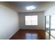 A bright, spacious bedroom with wood floors and access to a glass door at 11517 Koti Creek Ln, Thonotosassa, FL 33592